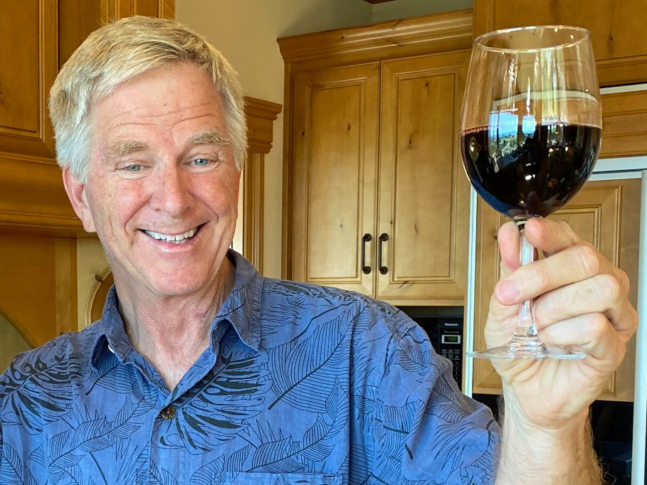 Rick Steves raises a glass of red wine.