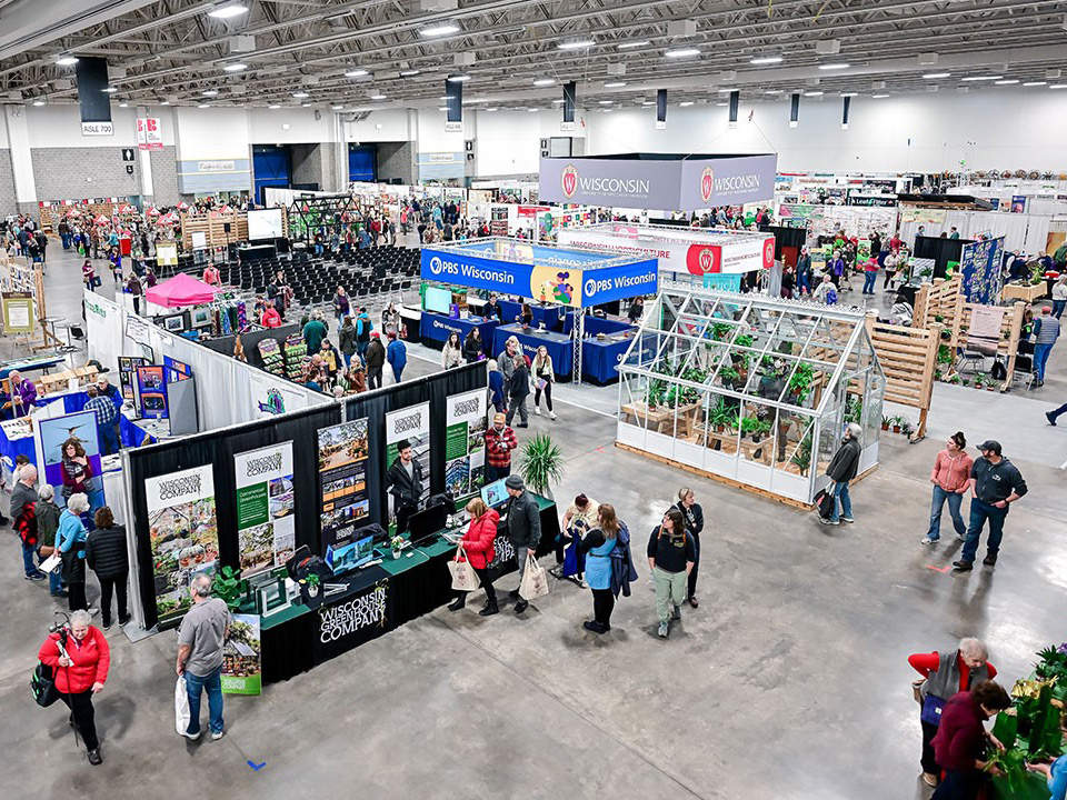 A view of people visiting the numerous booths at the Garden and Landscape Expo held at Alliant Energy Center.